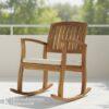 Kursi outdoor kayu solid model goyang dengan bantalan empuk di teras rumah