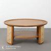 Meja kopi kecil kayu natural dengan desain minimalis dan aksen rotan elegan.